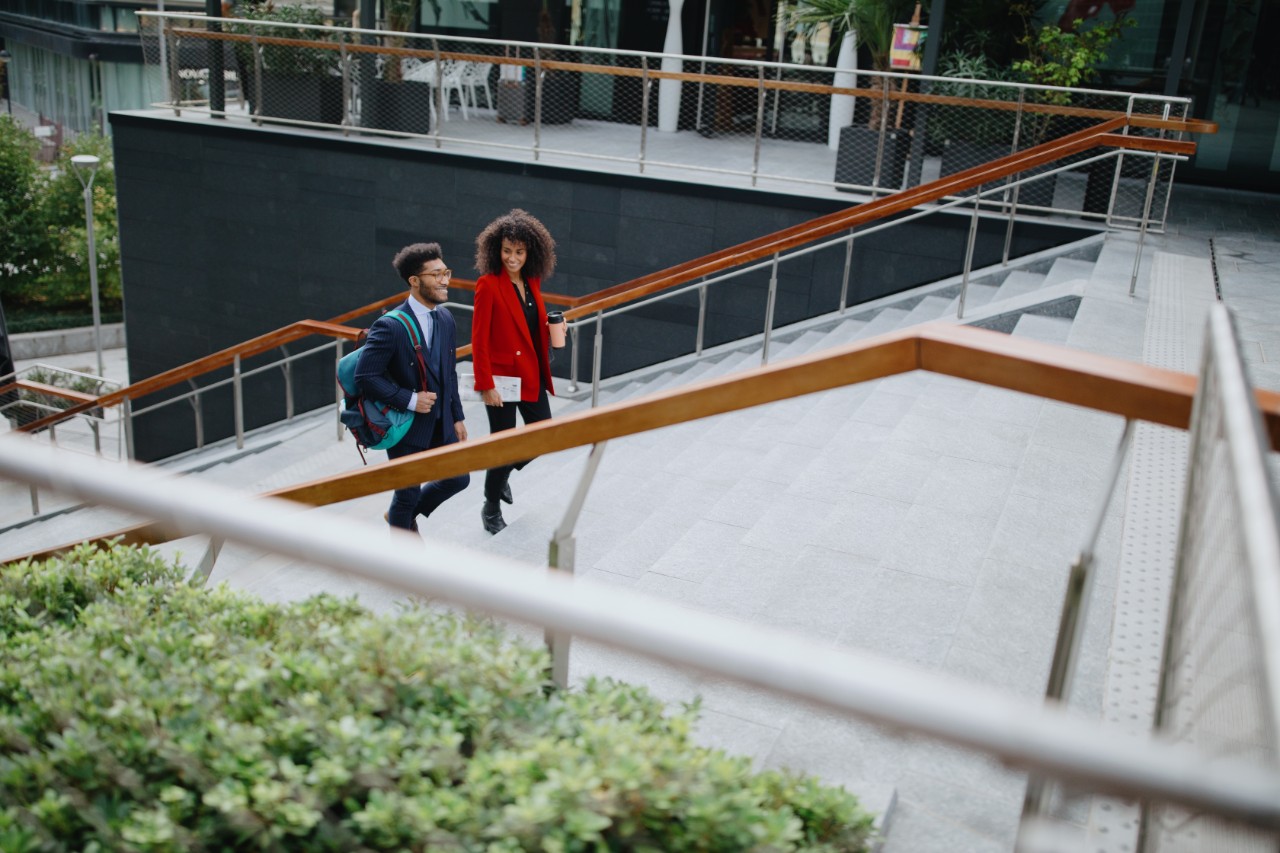 Business people climbing stairs